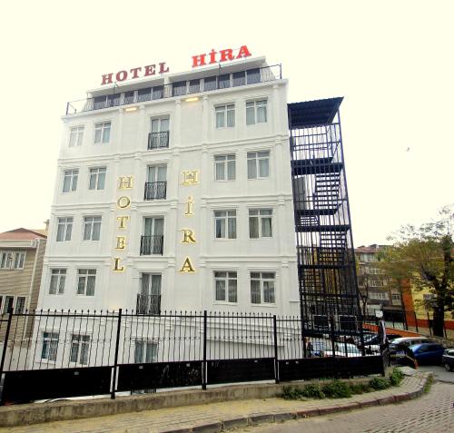a white building with a sign on top of it at Hira Hotel in Istanbul
