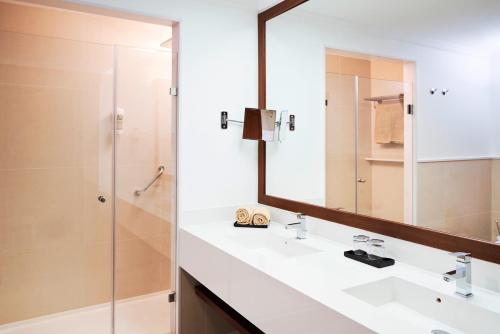 a bathroom with a sink and a mirror at TUI BLUE Falesia - Adults Only in Olhos de Água