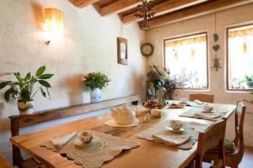 a wooden table in a room with a dining room at Regina Sconta in Villa Estense