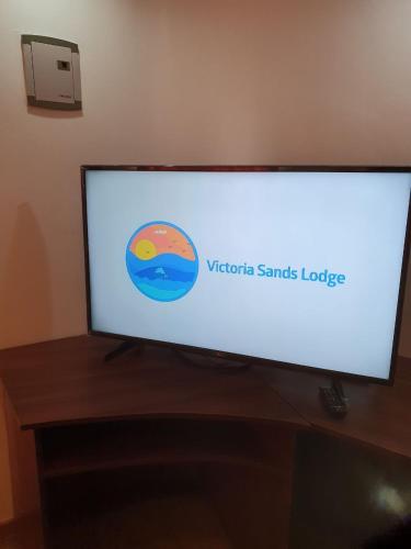 a flat screen tv sitting on top of a table at VICTORIA SANDS LODGE in Mbita