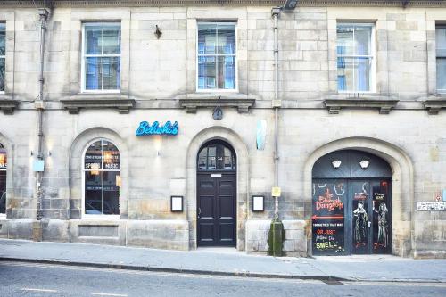 a building with two black doors on a street at St Christopher's Inn Edinburgh - Old Town in Edinburgh