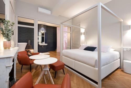 מיטה או מיטות בחדר ב-MiHotel Bizolon