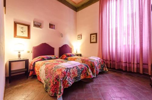 Katil atau katil-katil dalam bilik di Mercanzia Apartment, Palazzo Storico sotto le Due Torri