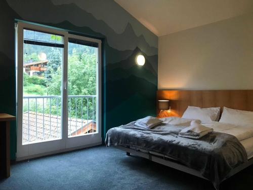 Postel nebo postele na pokoji v ubytování Ibex Lodge