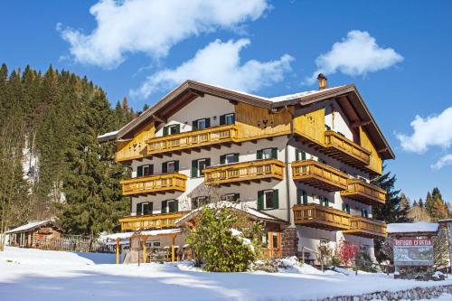 a large apartment building in the snow at Rifugio Cereda in Fiera di Primiero