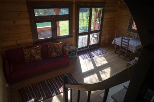 an overhead view of a living room in a log cabin at Sosnowy domek w rezerwacie nad Narwią in Bokiny