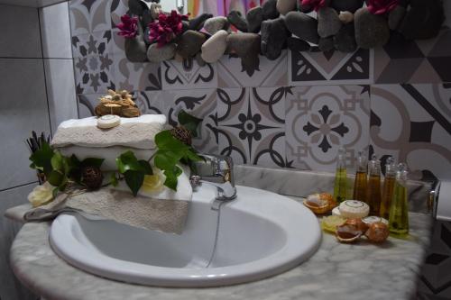 a bathroom with a sink and a counter top at Villa la Masia in Miami Platja