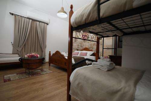 Ένα ή περισσότερα κρεβάτια σε δωμάτιο στο Hanna Koumi Boutique Hotel