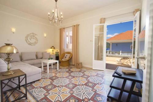 a living room with a couch and a table at Casa di Vito, 10m from Sami's main square in Sami