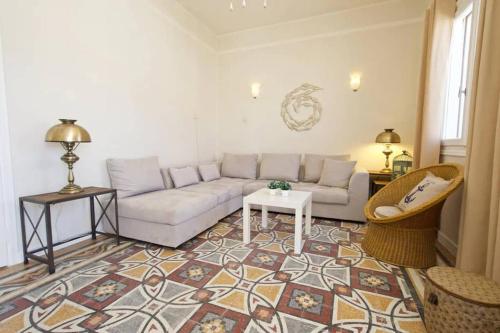 a living room with a couch and a table at Casa di Vito, 10m from Sami's main square in Sami