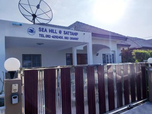 a house with a fence in front of it at Sea Hill Sattahip in Sattahip