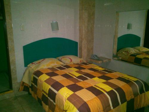 เตียงในห้องที่ Hostal Hostello - Lima Airport