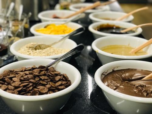 a group of bowls of food on a table at Hotel Sun in North Nicosia
