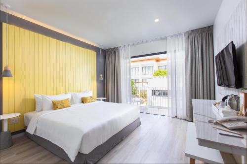 Postel nebo postele na pokoji v ubytování Sook Hotel