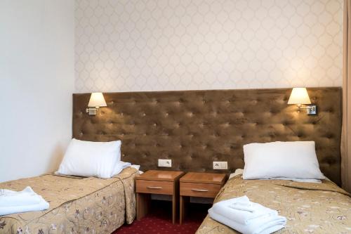 Postel nebo postele na pokoji v ubytování Hotel Karczówka