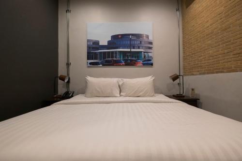 Postel nebo postele na pokoji v ubytování Iron32 Hotel