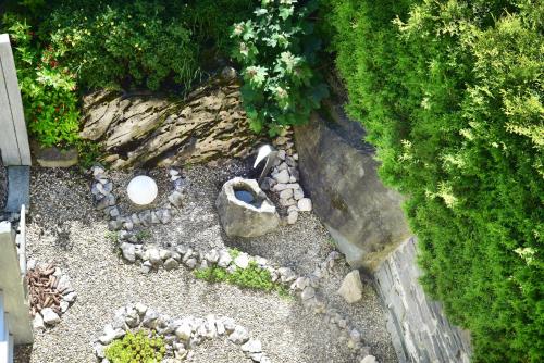 an overhead view of a garden with rocks and plants at Hotel Rovanada Wellness & BergNatur in Vals