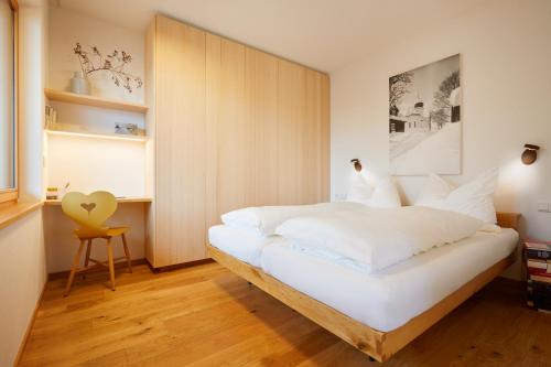 Säng eller sängar i ett rum på Landhaus Bergpanorama TOP 7