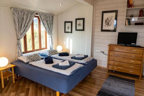 Postel nebo postele na pokoji v ubytování Hestasport Cottages