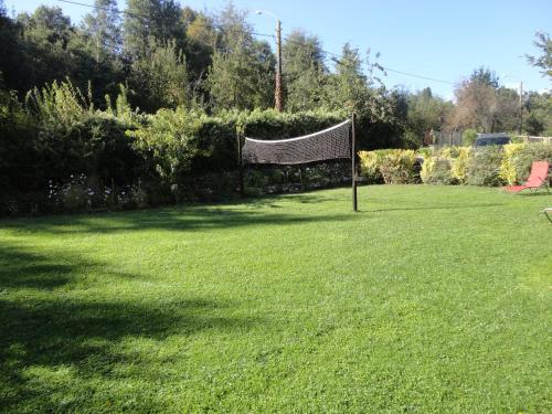 a goal in the middle of a grass field at Cabañas Spa Bungalows Huarranchi in Pucón