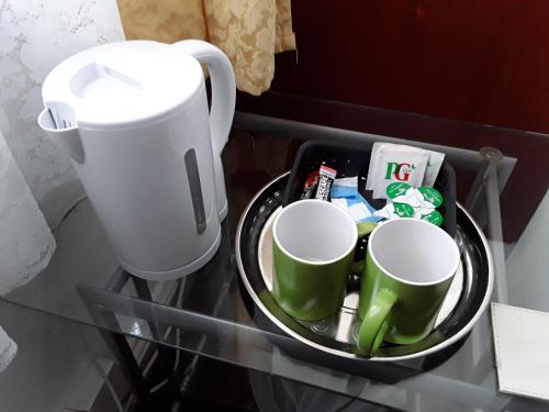 Príslušenstvo na prípravu kávy alebo čaju v ubytovaní Hotel Royale