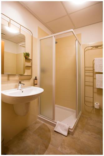 a bathroom with a sink and a shower at Santa Teresa House in Verona