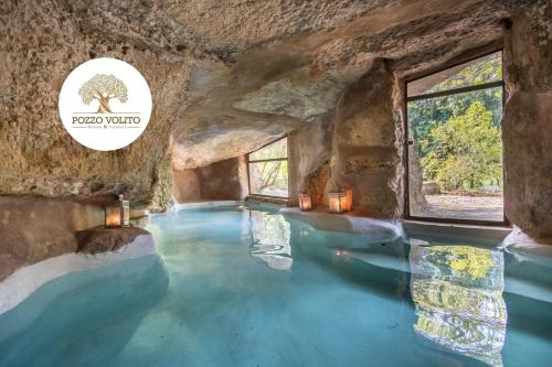 a swimming pool with blue water in a cave at "IL BOSCO" di POZZO VOLITO in Patù