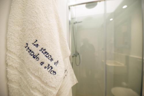 a towel with a message on it hanging in a bathroom at Le Stanze Di Brando E Nico in Tricase