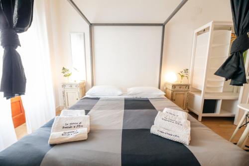 a bedroom with a large bed with two pillows on it at Le Stanze Di Brando E Nico in Tricase