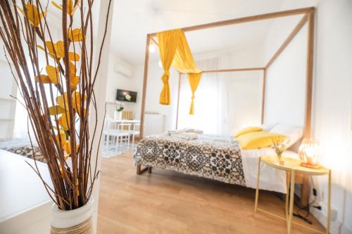 a bedroom with a bed with a large mirror at Le Stanze Di Brando E Nico in Tricase