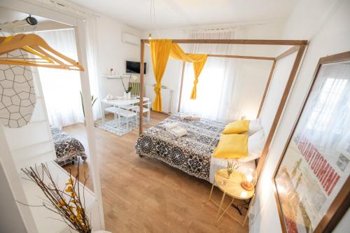 a bedroom with a bed and a mirror at Le Stanze Di Brando E Nico in Tricase