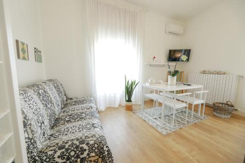 a living room with a couch and a table at Le Stanze Di Brando E Nico in Tricase