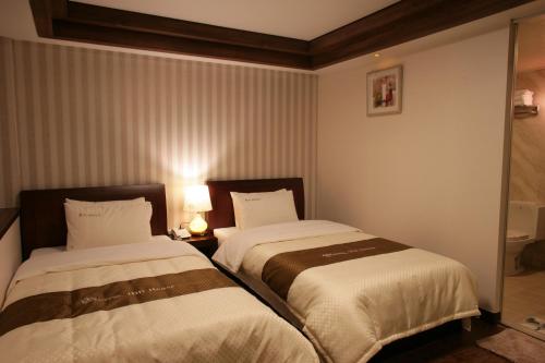 Katil atau katil-katil dalam bilik di Hill House Seoul Myeongdong