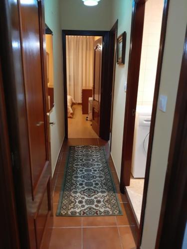 a hallway with a door and a tile floor at BERGANTIÑOS 41,1º izd in Ponteceso