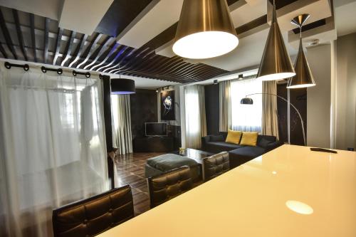 a hotel room with a bar and a large window at Boutique Hotel Medusa in Batumi