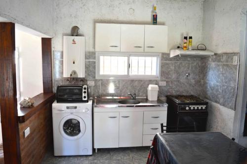 Una cocina o cocineta en Mini Complejo Familiar Roque