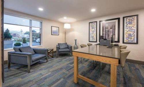 a living room filled with furniture and a large window at Holiday Inn Express Hotel & Suites Charlottetown, an IHG Hotel in Charlottetown