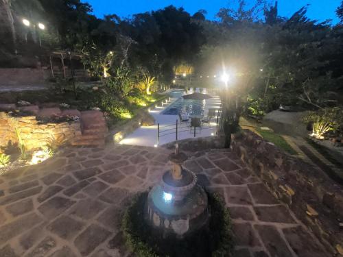 an overhead view of a courtyard at night at Hotel Casas de Campo El Ciruelo in San Gil