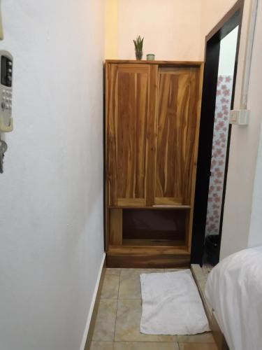 Postel nebo postele na pokoji v ubytování Viengchalern Guesthouse