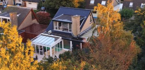 an aerial view of a house with a roof at Lake house 21 relax accommodation iR Sauna in Warmond