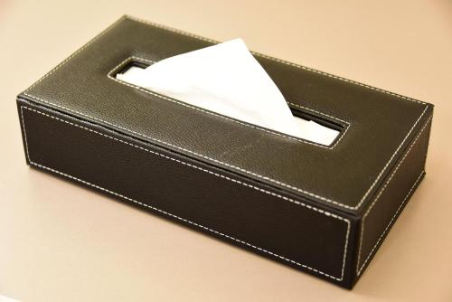 a black wallet with a piece of paper in it at Hotel Sankyo Fukushima in Fukushima