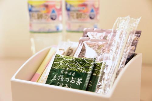 a white box filled with books and papers at Hotel Sankyo Fukushima in Fukushima