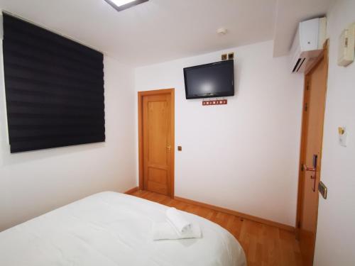 Posteľ alebo postele v izbe v ubytovaní Hostal Quinta Santillan