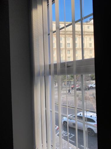 a window with a view of a parking lot at Brownlows Inn Rooms formerly Riley's Rooms in Liverpool