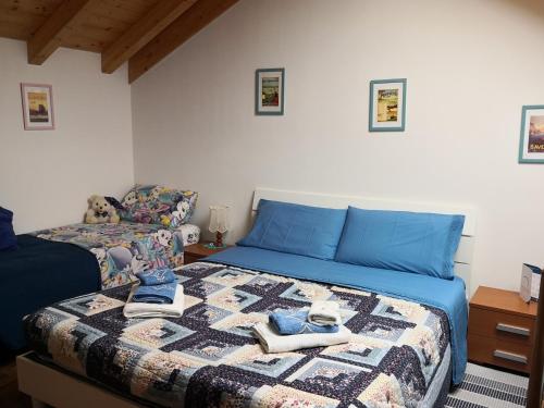 a bedroom with a bed with shoes on it at Il Planetario in Verbania