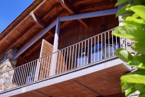 a balcony on the side of a house at El carrero in Abella