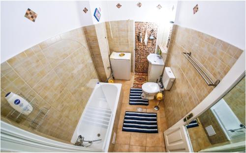 an overhead view of a bathroom with a sink and toilet at Clucerului Sun Residence Villa in Bucharest
