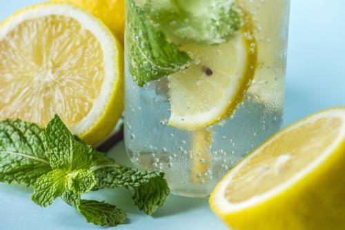 a glass of lemonade with a slice of lemon and mint at Akasa Goa in Palolem