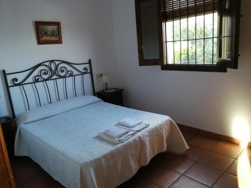 מיטה או מיטות בחדר ב-Casa Rural La Loma