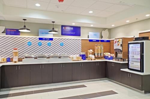 a fast food restaurant kitchen with a counter top at Holiday Inn Express & Suites - Phoenix North - Scottsdale by IHG in Phoenix